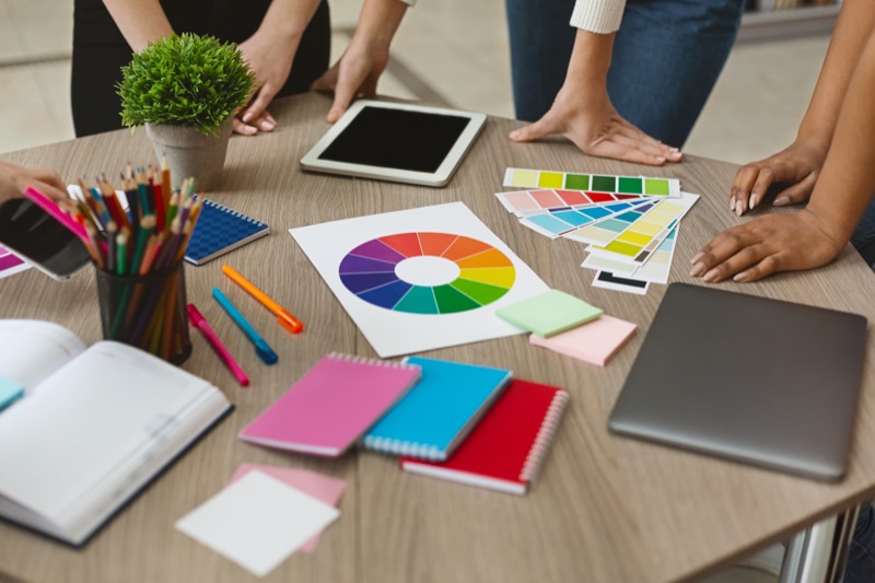 group of graphic designers checking on color swatch samples