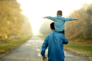 father and son walk in nature