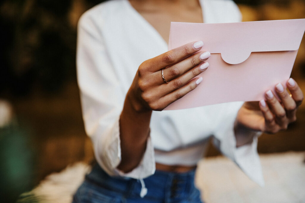 holding an envelope