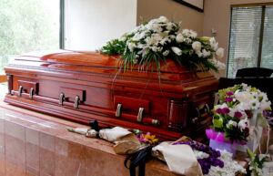 closeup shot of a colorful casket in a hearse or chapel before f