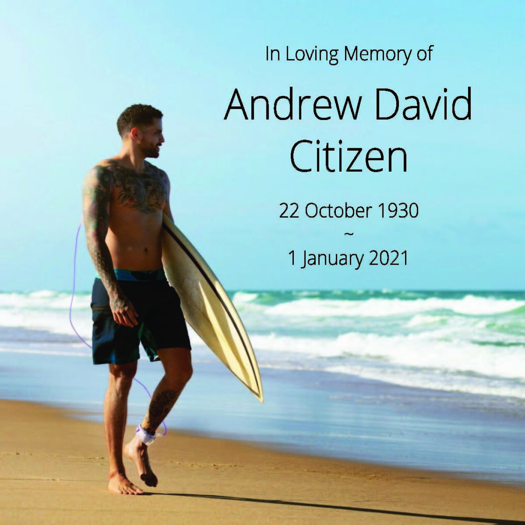 Man with surfboard on beach, memorial text overlay.