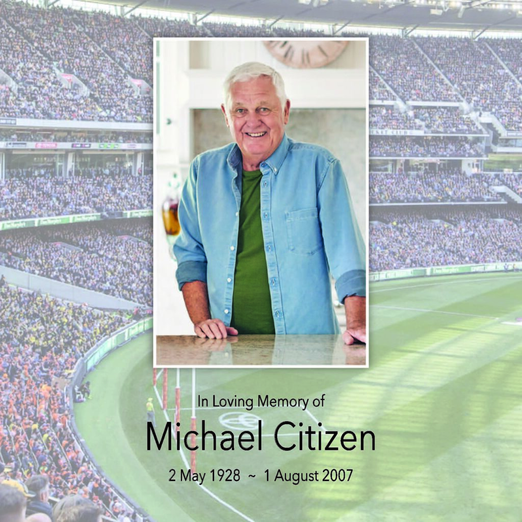 Memorial image at crowded stadium, man smiling.