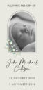 Memorial for baby with dates and floral design.