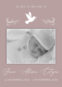 Memorial card with baby photo and dove illustration.