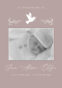 Memorial card with baby photo and dove design.