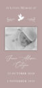 Memorial card with baby's photo and dates.
